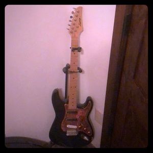 Legacy electric guitar comes with amplifier.